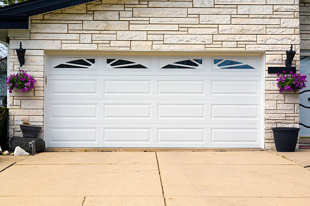 Cooper Garage Door Solutions INC technicians on a panel replacement job